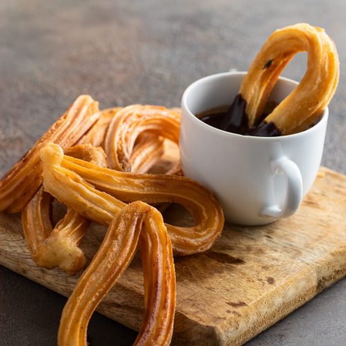 Traditional,Spanish,Breakfast,Churros,Churros,,Fried-dough,Pastry,And,Cup,Of